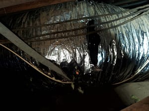 HVAC Duct tear leaking cold air from air conditioning into the attic making the pests comfortable and wasting your utility bill.
